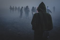 Silhouettes several people in the fog