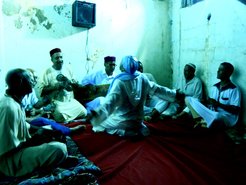 Diwan ritual of the Bilaliyya Order one of many different registers of Sufism in Algeria. In the photo, the young man facing the musicians is being musically worked into a process of trance. Oran (Algeria) 2016